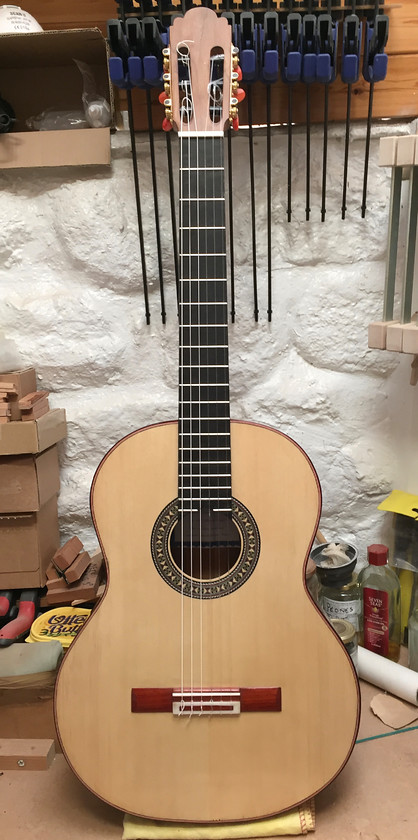 Chris Smith Classical No.7 
 A new Chris Smith Handmade Spanish classical guitar. Scale 650mm. Engleman spruce top, American Walnut back & sides, Ebony fingerboard 19 frets, padook bindings & bridge. Bone nut and saddle. Scale 650mm. Made in 2020. Price 3,100 excluding hard case. 
 Keywords: Spanish, Classical, Guitar, Spruce, Walnut, Handmade, Luthier, Cornwall, Musical instruments, St Ives, Music, Ebony